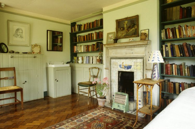 The interior of Virginia Woolf's bedroom at Monks House looking towards the fireplace.
